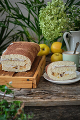 apple cinnamon sponge roll cake with cream cheese and caramelized apples