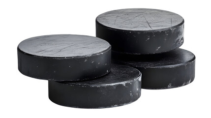 Stack of black hockey pucks with subtle texture,