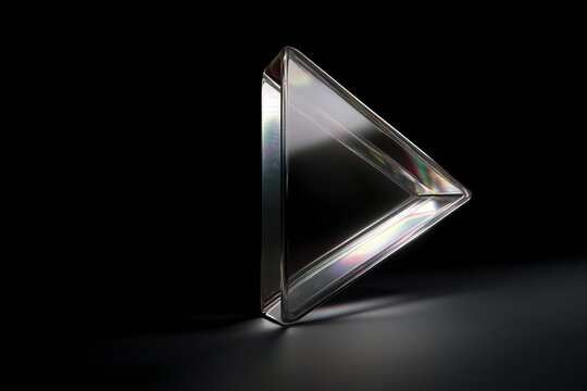 Transparent glass triangle on dark background, showcasing a minimalist design concept, ideal for modern presentations or product displays, suggesting sleekness and elegance