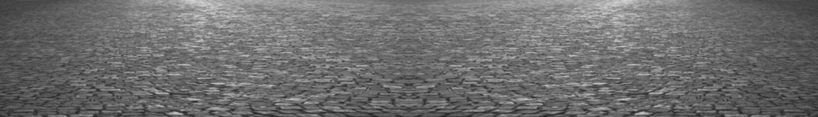 Old square cobble stone with green grass. paving perspective background.Paving stone pavement texture. Cobblestone pavement. stone sidewalk. texture. Cobble stone road cobble texture. perspective