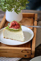 a piece of cheesecake with fig. cottage cheese casserole.	