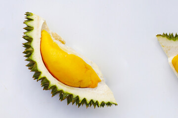 Fresh durian fruit segments on white background.