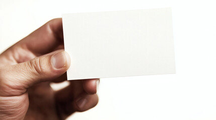 Obraz premium Hand holding blank business card, white background. Use Mockup, template