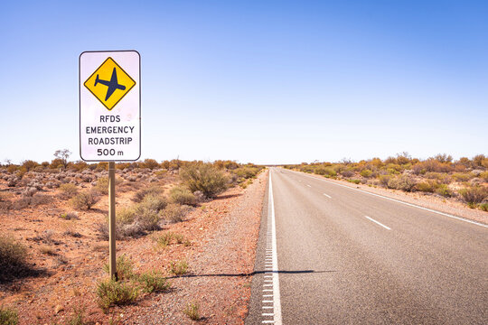 Road sign warning drivers of an upcoming emergency runway section of the A87 Stuart Highway in the Australian Outback, for the Royal Flying Doctor Service of Australia to land a plane on the road