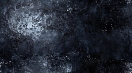 A dark, textured surface with varied shades of deep blue and gray.