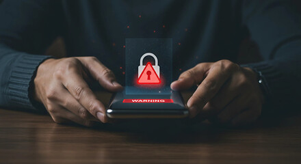 Close-up of hands holding a smartphone displaying a warning sign. A modern safety and alert concept, symbolizing danger, risk, or cybersecurity threats.