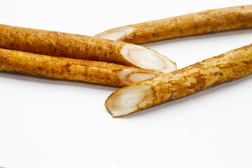 Burdock Root (Gobo) on white background.