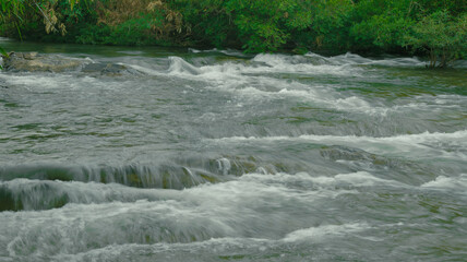 water flowing over the river