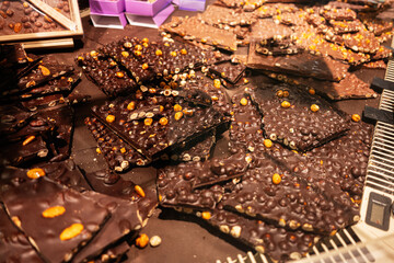 Delicious Assorted Chocolate Nut Bars Displayed in a Confectionery Store Setting