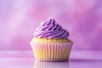 A delicious cupcake with purple frosting against a soft background