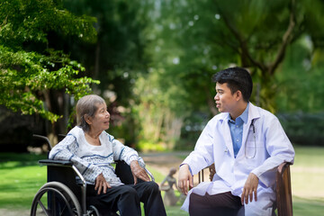 Doctor checking lung of elderly woman during homecare medical..