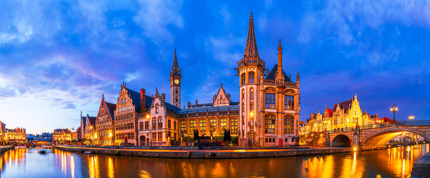 Gent, Belgium: Panoramic view of Graslei old town and embankment Graslei over Leie river at sunset