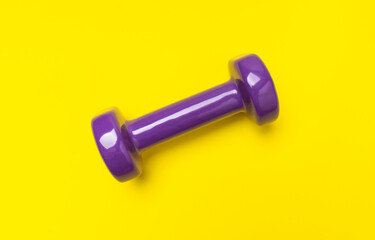 Dumbbells for fitness, sports on yellow background. Concept of healthy lifestyle, wellness, sports equipment for beautiful figure, top view flat lay