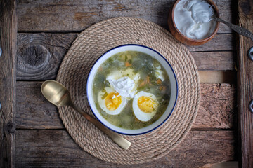 Green borscht. Sorrel soup with egg and sour cream.