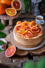 Blood Orange Cheesecake. Wooden background