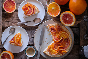 Blood Orange Cheesecake. Wooden background