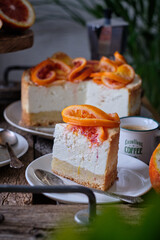 Blood Orange Cheesecake. Wooden background