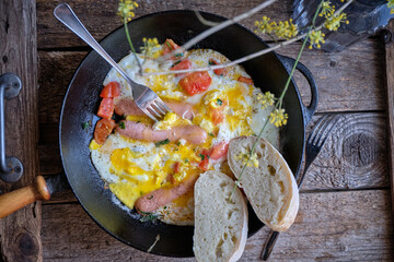 Breakfast, scrambled eggs, salad, sandwich, toast.