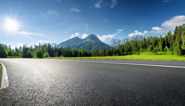 asphalt road and green forest with mountain on a sunny day