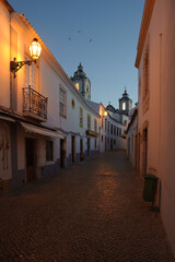 Charming street in the old town of Lagos at dusk, Portugal