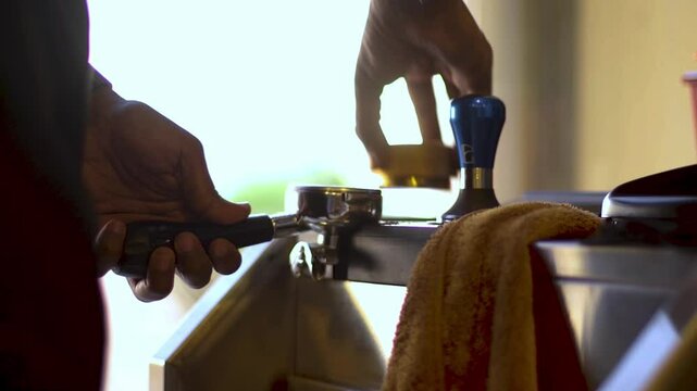 preparing grinded coffe by profissional barista afternoon