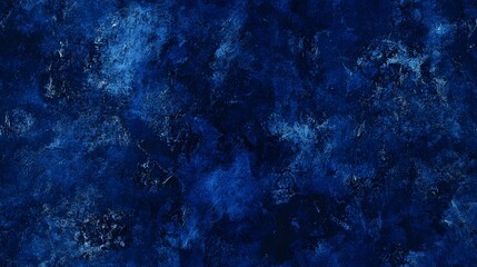 Fototapeta premium A deep blue textured surface with mottled and speckled patterns.