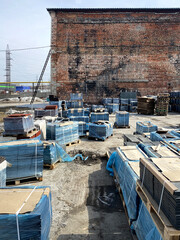 Fototapeta premium Paving slabs, shop, paving slabs warehouse. Different paving slabs vertical photo