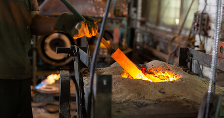 Ferrous metal billet is melted in an induction furnace closeup