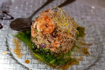 Quinoa salad with shrimp in a glass dish