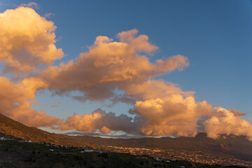 Orange clouds at sunset in La Palma, Tazacorte, with banana trees below. La Palma island Canary...
