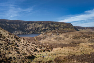 Discover a tranquil Bray lake surrounded by hills and rugged landscapes, perfect for nature lovers and adventurers eager to experience the beauty of the outdoors, Wicklow, Ireland