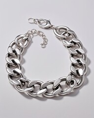 Obraz premium A chunky silver chain and bracelet jewelry set in plain white background