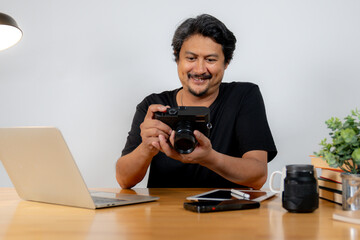 Creativity and freelance occupation concept, Young Man Photographer Working from Home