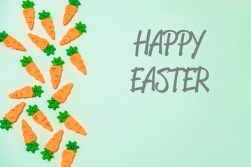 Bunch of carrots are scattered across a green background