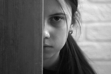 Emotional and behavioral problems of adolescents concept. Teenage girl. Black and white portrait of...