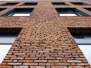 Fototapeta premium Elements of the facade of a building covered with decorative brick, background