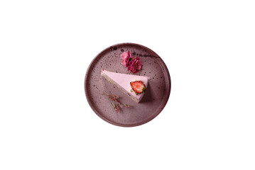 A slice of pink colored puff cake for a birthday celebration