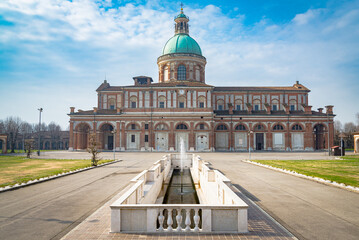 The famous ancient Caravaggio's Chatedral, close to Milan, Italy. View of the church from outside, on a sunny day, with blue sky and white clouds on the background.