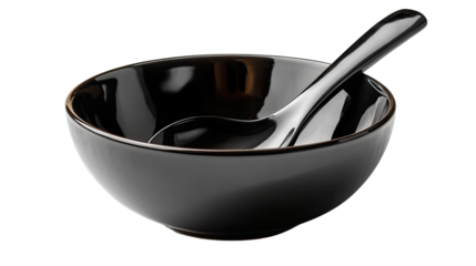 Black Ceramic Bowl with Spoon: A sleek, black ceramic bowl rests beside a matching spoon. This image exudes simplicity and elegance, perfect for culinary and design projects.
