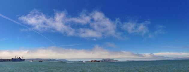 Panorama of a coastal seascape with visible bay and distant shoreline