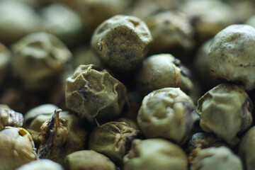 Close up of green peppercorns . Macro shot.