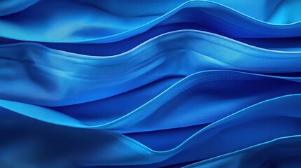 Fototapeta premium Close-up of flowing blue fabric waves creating a smooth texture, ideal for textile design