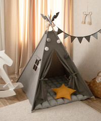 Playroom with Teepee. Modern room interior with play tent for child. children's wigwam in the room on the floor Scandinavian style with decor. High quality photo