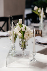 Luxury, elegant wedding reception table arrangement, floral centerpiece. Wedding cake.
