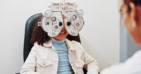 Eye test, optometry and optician with kid in clinic with phoropter for prescription lens....