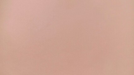 Soft nude brown pastel matte background. Elegant warm neutral tone with smooth texture. Earthy minimalist surface design. Cozy taupe beige aesthetic 2025.