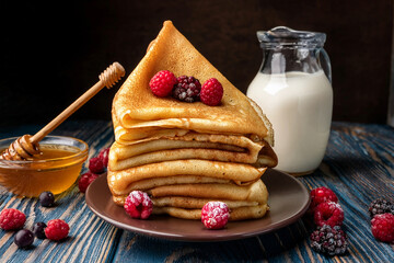 Homemade american pancakes with fresh blueberry, raspberries and honey. Healthy morning breakfast. rustic style