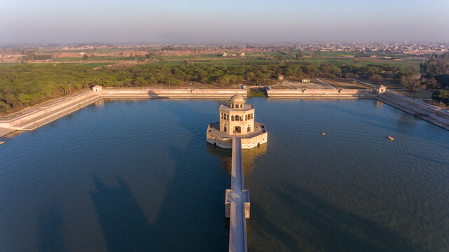 Aerial view of Hiran Minar surrounded by serene water and lush greenery, Sheikhupura, Punjab, Pakistan.