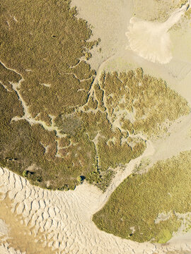 Aerial view of unusual sand patterns in wetlands, Isla Cristina, Huelva, Spain.