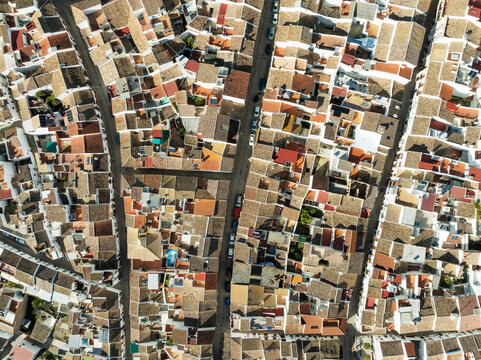 Aerial view of picturesque Olvera town with colorful rooftops and historic buildings, Cadiz, Spain.